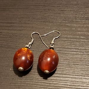Drop earrings. Brownish orange